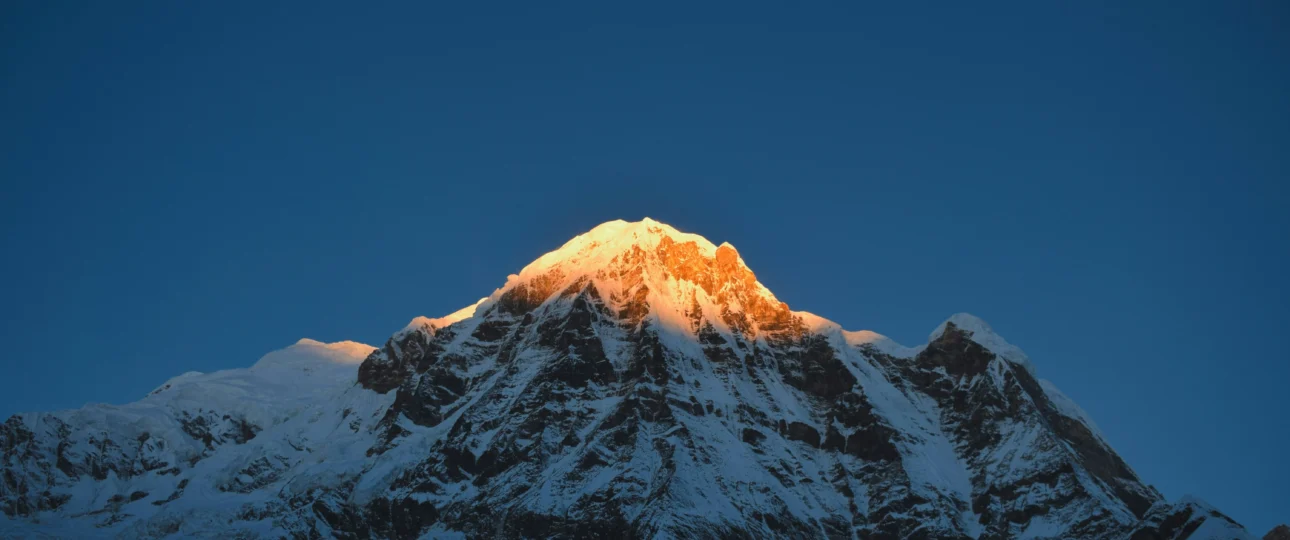 Annapurna base camp trek cost- view of annapurna with sun shining at peak